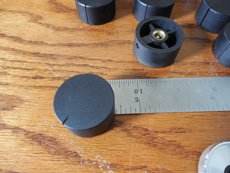 NOS Receiver knobs Black 1-5/8″ Dia 3/4″ tall ” Aluminum covered plastic.