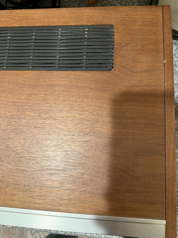 Realistic STA-76 was a silver-fronted stereo receiver with a walnut-grained gallery