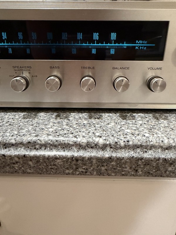 Realistic STA-76 was a silver-fronted stereo receiver with a walnut-grained gallery